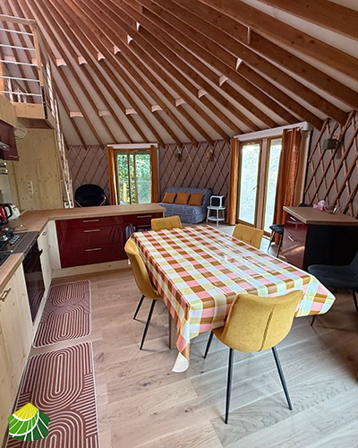 Kitchen area of a modern wooden yurt